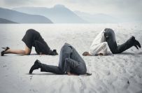 Fear of crisis with businessman like an ostrich