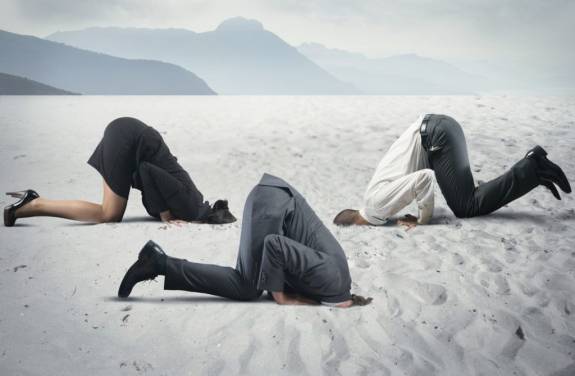 Fear of crisis with businessman like an ostrich